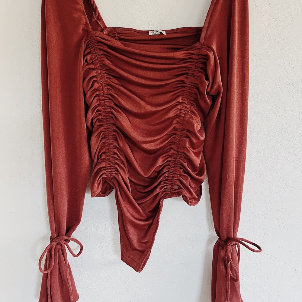 Burnt orange free people body suit/leo